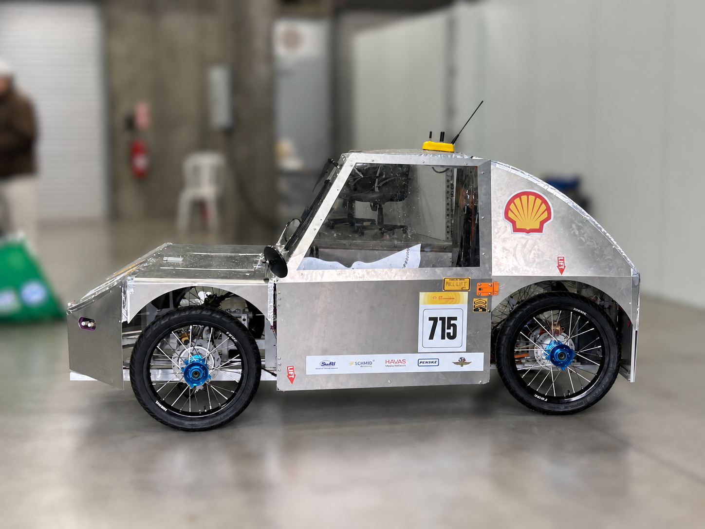 Carbon-bodied competition EV in the pit lane